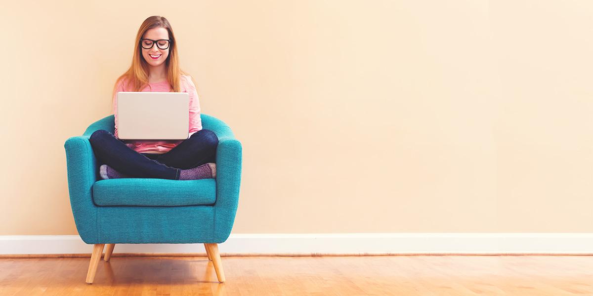 illustrative picture of a lady holding a computer