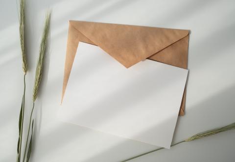 An envelope and an empty card on a table.